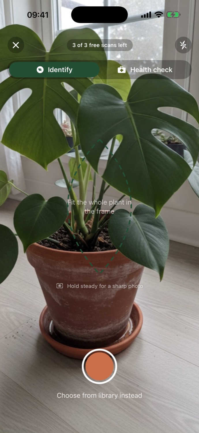 PlantSage camera screen framing a houseplant leaf inside a terracotta guide circle